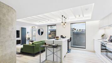 Deluxe Penthouse, 2 Bedrooms | Desk, laptop workspace, iron/ironing board, free WiFi