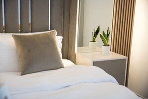 1 bedroom, desk, iron/ironing board, travel crib