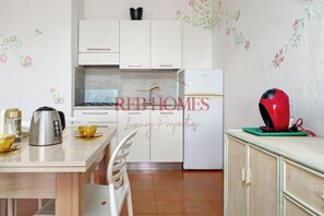 Fridge, microwave, stovetop, coffee/tea maker
