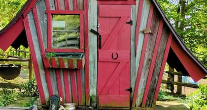 Hunting Cabin Rustic Handcrafted primitive sits in our unique rustic Cowboy Town