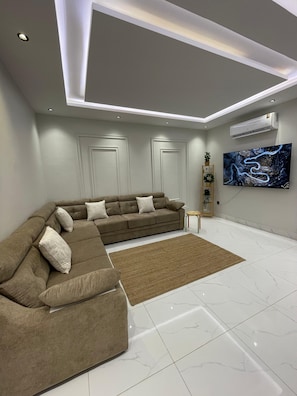 Apartamento, 2 quartos | Área de estar