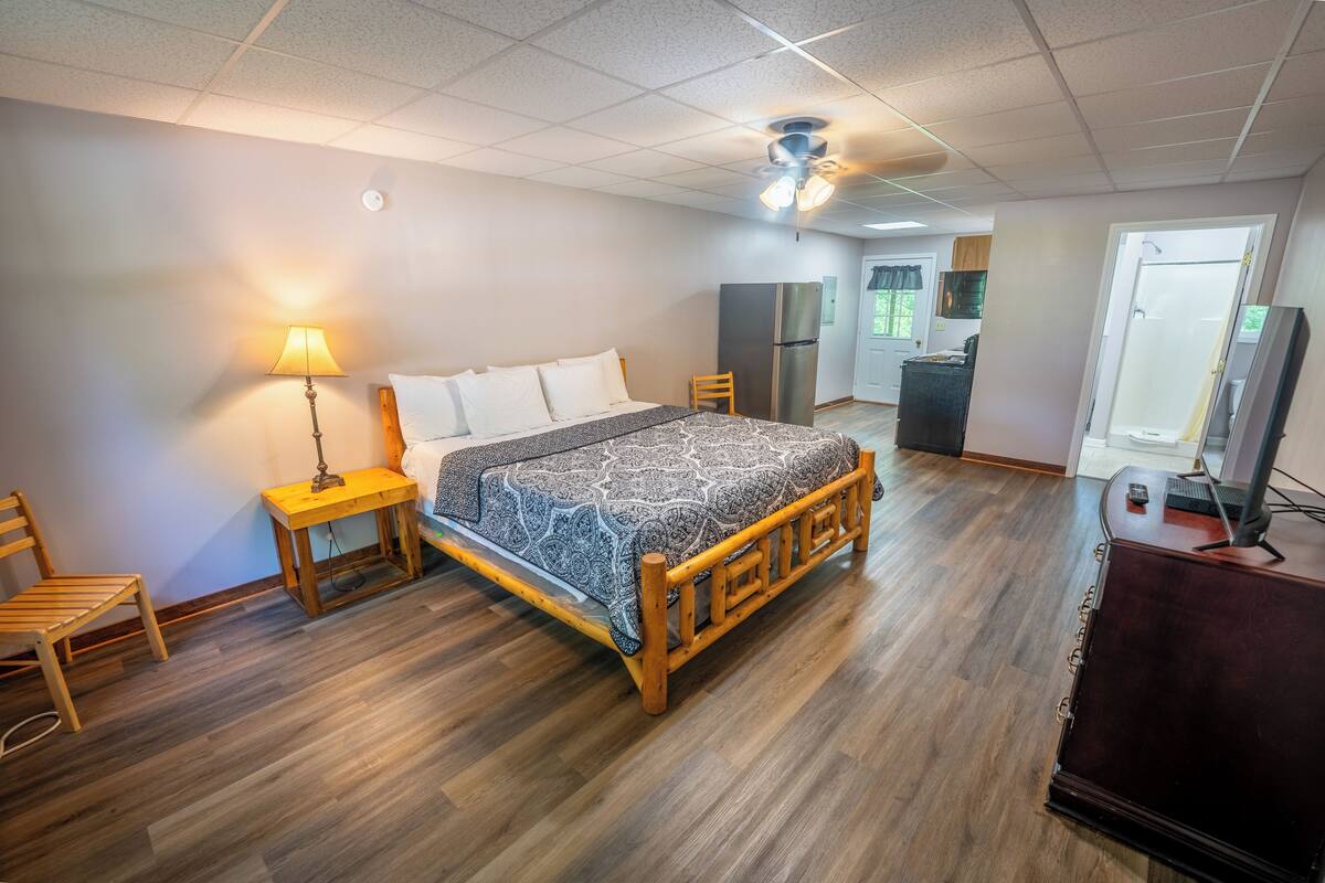 Deluxe Duplex | Living area | 30-inch flat-screen TV with cable channels