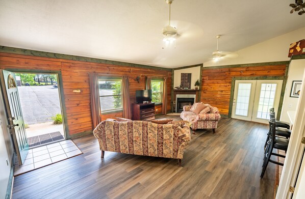 Family Cabin, Multiple Beds, Roll-in Shower, Pets Allowed | Living area | 30-inch flat-screen TV with cable channels