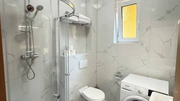 Shower, hair dryer, towels, soap