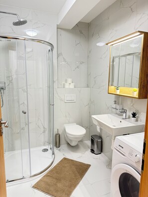 Shower, hair dryer, towels, soap