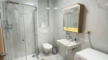 Hair dryer, towels, soap, toilet paper