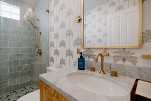 Shower, hair dryer, towels, shampoo
