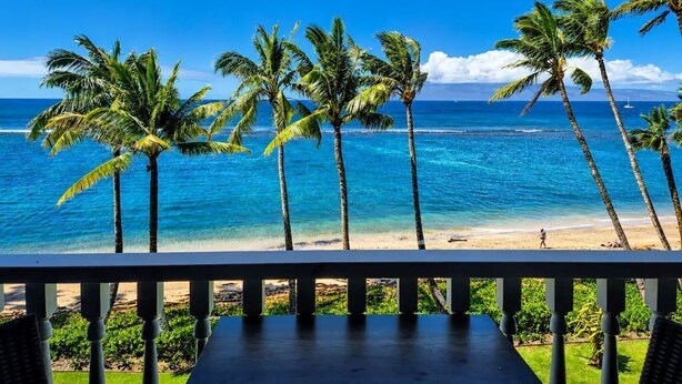 A beach view with palm trees and a clear sky. - Oceanfront Maui Escape! Panoramic Views, Pool, Hot Tub & Steps to Beach (Lahaina)