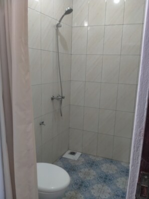 Standard Room | Bathroom | Shower, towels, soap, toilet paper