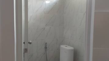 Standard Room | Bathroom | Shower, towels, soap, toilet paper