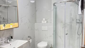 Shower, hair dryer, towels, soap