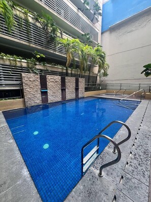 Outdoor pool, open 9:00 AM to 8:00 PM, sun loungers