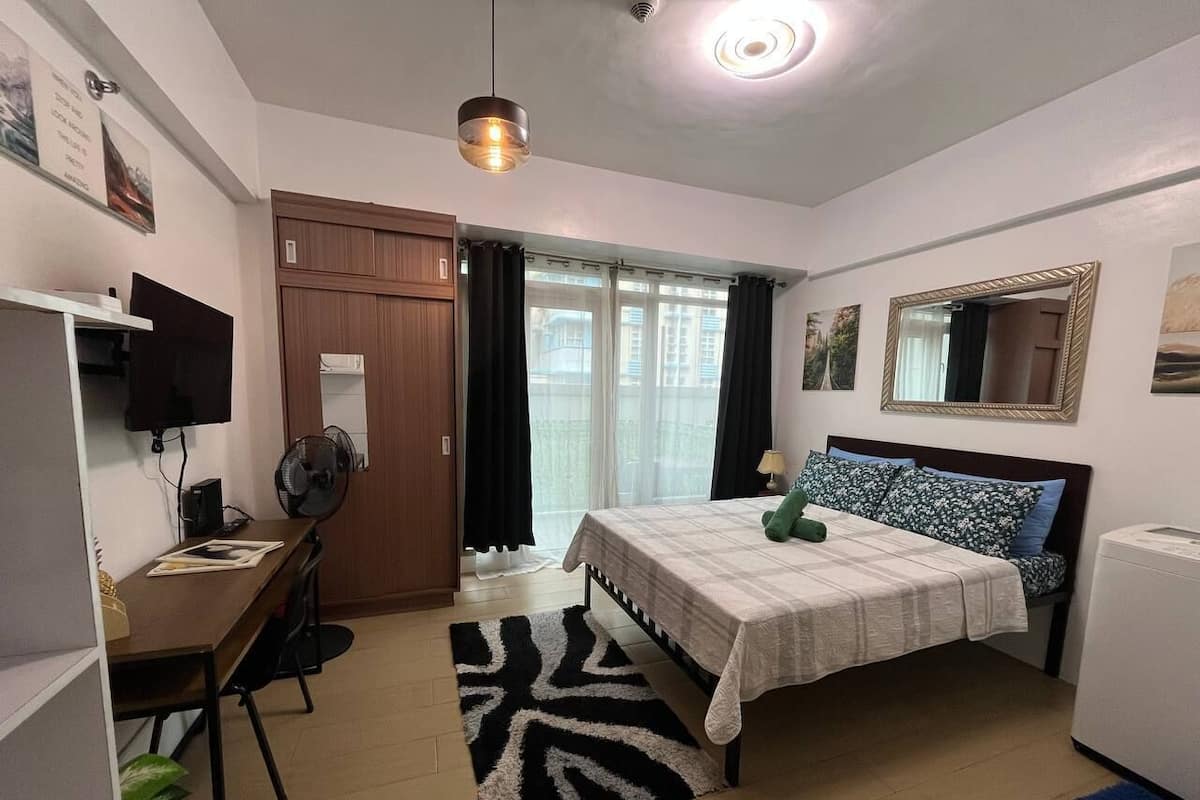 Standard Condo | Desk, laptop workspace, blackout drapes, iron/ironing board