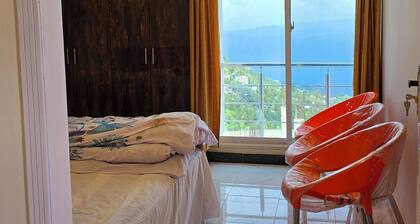 Bhurban Nights - High Floor and huge glass windows with stunning views across