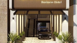 A modern building with a sign reading "VAIGAI RESIDENCY Business Hotel". - Vaigai Residency (Salem)