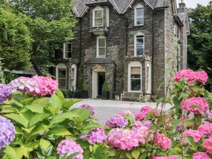 A stone building with a sign reading "GRASENBERG HOTEL". - Coleridge (Ambleside)