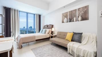 Deluxe Studio | Desk, laptop workspace, blackout curtains, iron/ironing board