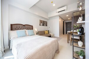 Deluxe Studio | Desk, laptop workspace, blackout drapes, iron/ironing board