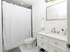 Shower, hair dryer, towels, soap