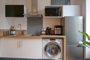 Fridge, coffee/tea maker, cookware/dishes/utensils