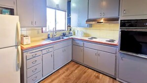 Fridge, microwave, stovetop, cookware/dishes/utensils