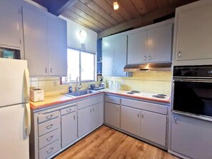 Fridge, microwave, stovetop, cookware/dishes/utensils