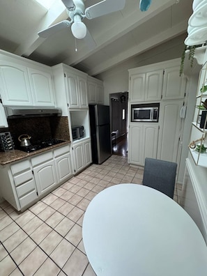 Fridge, microwave, stovetop, coffee/tea maker