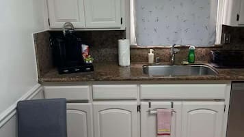 Fridge, microwave, stovetop, coffee/tea maker