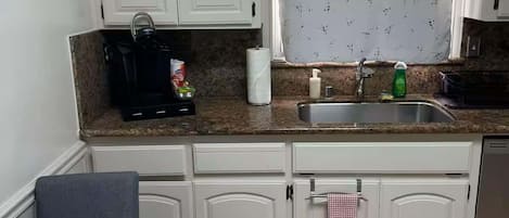 Fridge, microwave, stovetop, coffee/tea maker