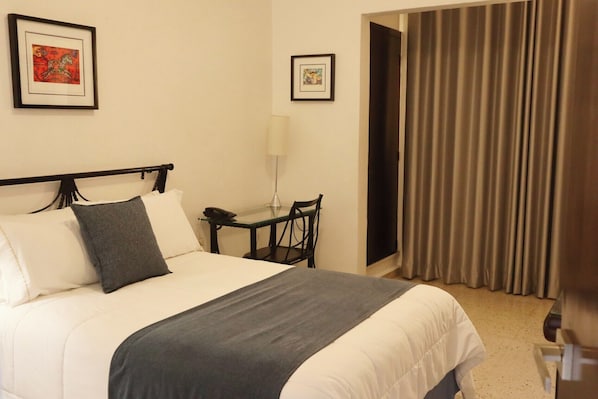 Basic Single Room, Courtyard View | In-room safe, laptop workspace, blackout curtains, free WiFi