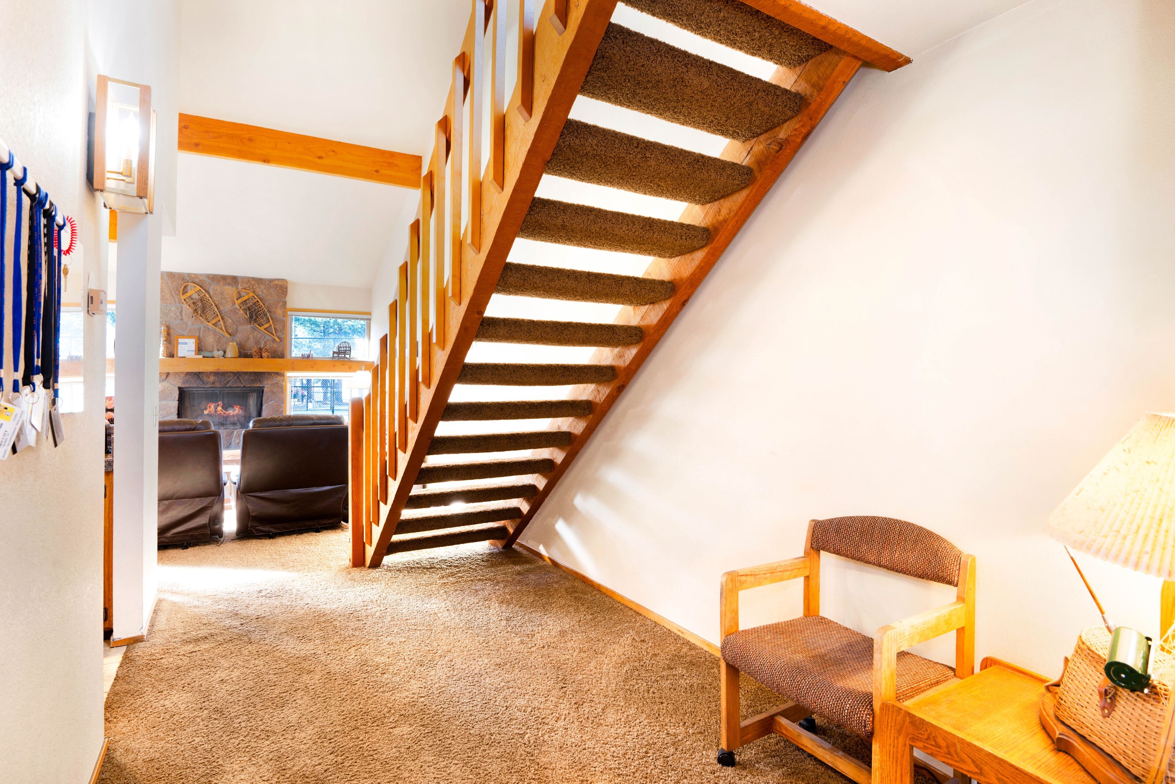 A staircase with wooden steps leading to a loft area.