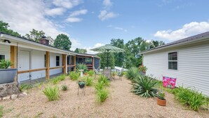 A residential property with a gravel driveway, potted plants, and a patio area with outdoor furniture. - 'The Garden Cottage' w/ Yard & Views in Erwin! (Erwin)
