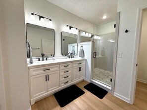 Shower, hair dryer, towels, soap