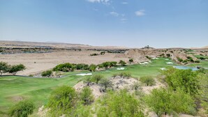 A golf course with bunkers, water hazards, and a clear blue sky. - Golf Course Views & Private Deck: Mesquite Condo! (Mesquite)