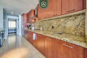 Fridge, microwave, oven, stovetop - Oceanfron 4 BR Condo - Beach - Wyndham Pool (Nuevo Vallarta)