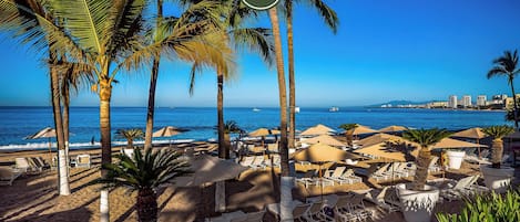 On the beach, sun-loungers