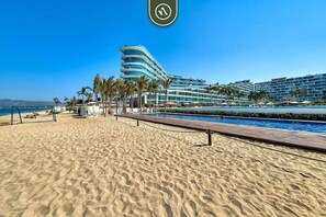 On the beach, sun-loungers
