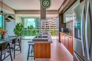 Fridge, microwave, stovetop, coffee/tea maker