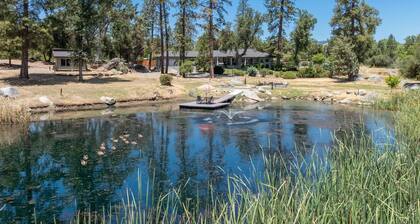 Riverbend Retreat 5-bedroom villa with spa, pond, gym, and private bar.