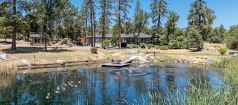 Riverbend Retreat  5-bedroom villa with spa, pond, gym, and private bar.