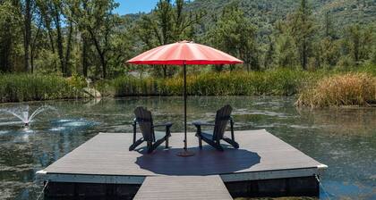 Riverbend Retreat, 5 bedrooms, 3200 sq ft hot tub, pond, gym, and private bar.