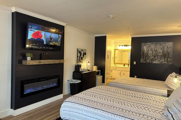 Legends Fountain View unit 109 fireplace with two queen beds