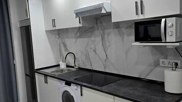 Fridge, microwave, toaster, cookware/dishes/utensils