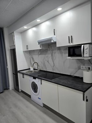 Fridge, microwave, toaster, cookware/dishes/utensils