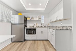 Fridge, microwave, coffee/tea maker, toaster