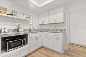 Fridge, microwave, coffee/tea maker, toaster