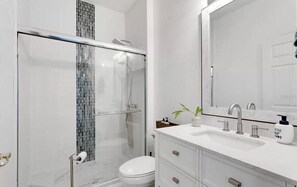Shower, hair dryer, towels, soap