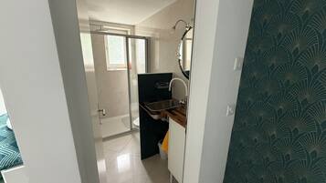 Shower, towels, soap, toilet paper