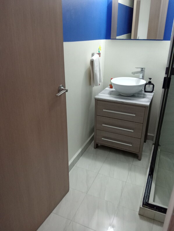 Shower, towels, soap, toilet paper