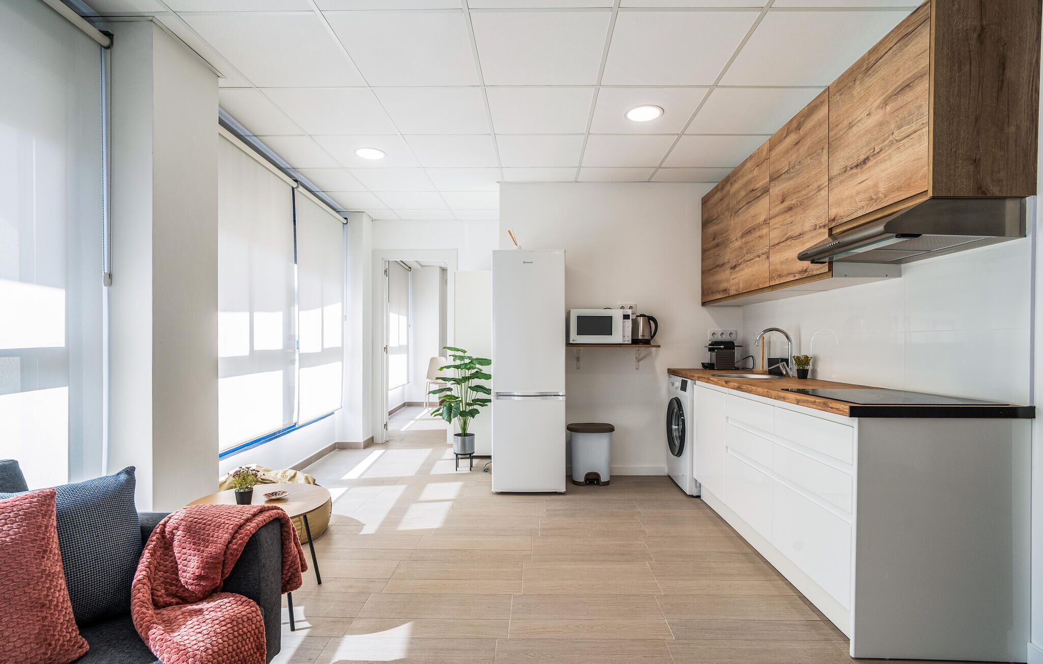 Fridge, microwave, coffee/tea maker, cookware/dishes/utensils